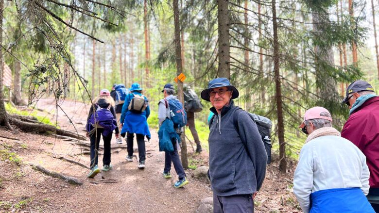 small group of people on national park hike in helsinki