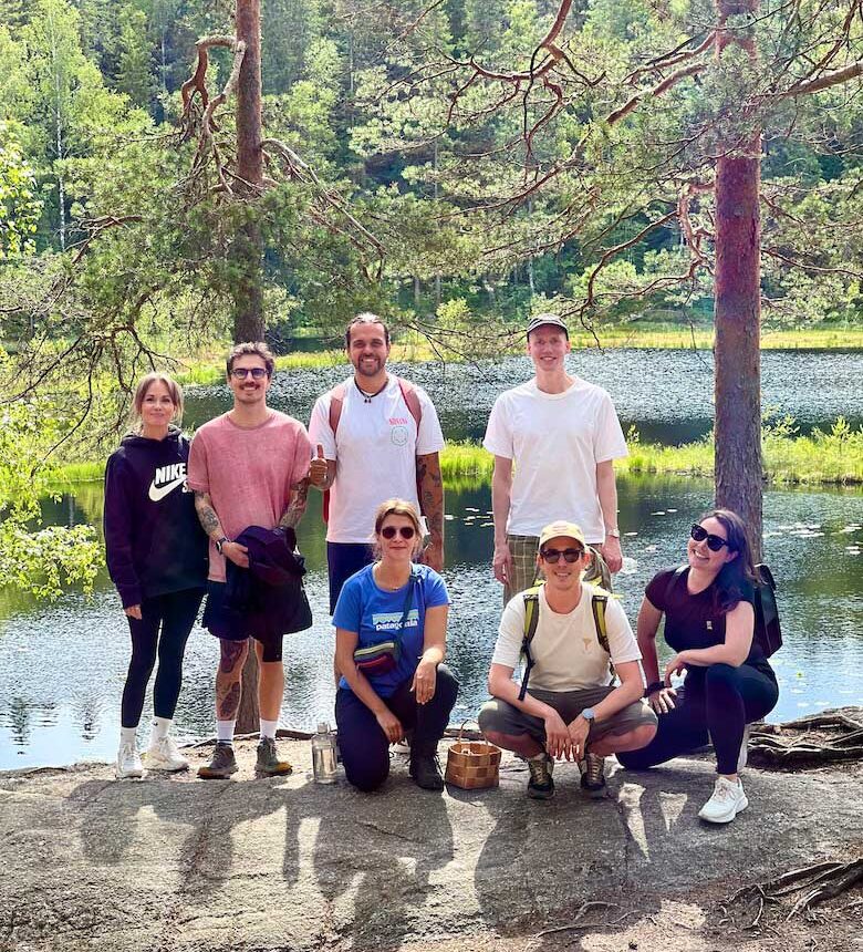 small group in a nuuksio naitonal park by a lake